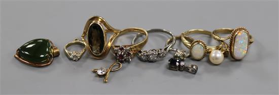 A palladium and three stone diamond ring, four 9ct gold and gem set rings, four gem set pendants and two ring charms.